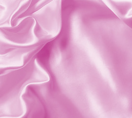 Smooth elegant pink silk or satin texture as background