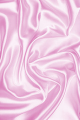Smooth elegant pink silk or satin texture as background