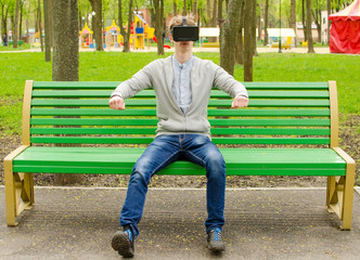 Young man using virtual glasses