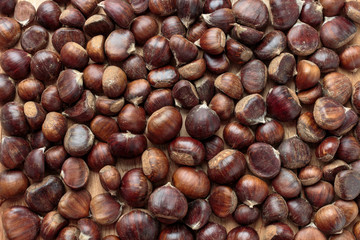 Pile of chestnuts autumn background