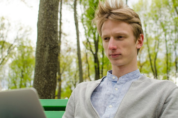 Young man using his laptop 