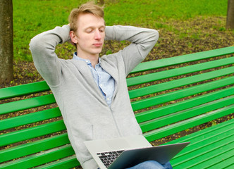 Young man using his laptop 