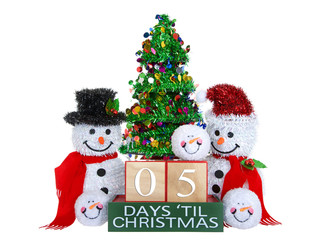 05 Days until Christmas light beech wood blocks with red trim on a green base with tinsel christmas tree, mr and mrs snowman and snowball snowmen heads isolated on a white background.