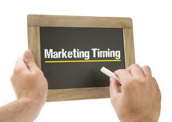 Marketing Timing / Hand writing on chalkboard