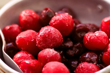 A macro shot of frozen fruit berries - cherry, background