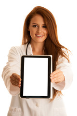 Fototapeta premium health care and medicine - young woman doctor isolated over whit