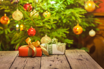 Decorated and illuminated Christmas tree on indistinct, blurred and  fairytale background.
