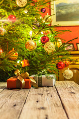 Decorated and illuminated Christmas tree on indistinct, blurred and  fairytale background.
