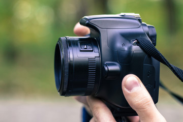 Paparazzi man taking picture with DSLR photo camera