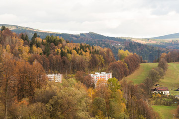 Summer landscape and the dark blue sky with clouds in mountains