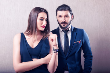 Heterosexual couple interacting and elegantly dressed