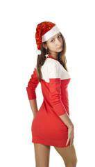 Girl in a Christmas hat with snowflakes and red dress