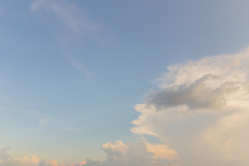 Naklejka na ściany i meble Soft white clouds against blue sky background.