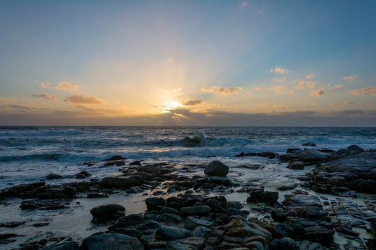Sundown in Cape Town, South Africa with splashing waves © Benjamin