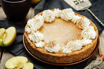 apple pie decorated with whipped cream