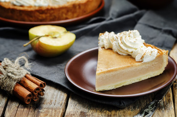 apple pie decorated with whipped cream