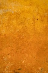 orange and copper-colored background in the form of old and rusted metal