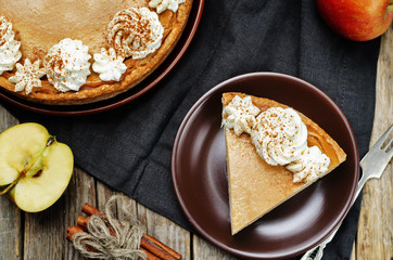 apple pie decorated with whipped cream