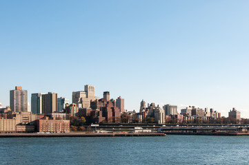 Manhattan skyline from bay on sunny day