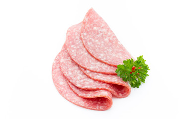 Salami smoked sausages slices isolated on white background.