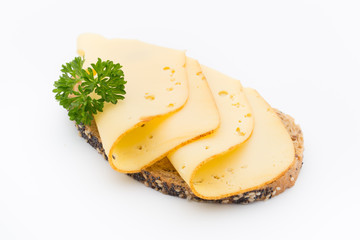 Cheese slices on bread. White background.
