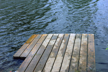 Fototapeta premium wooden jetty at a small village the river in Russia in summer