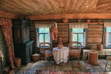 traditional interior of old Russian log village house of 19th ce