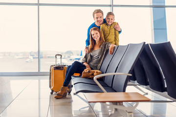 Obraz premium Family waiting for departure at airport