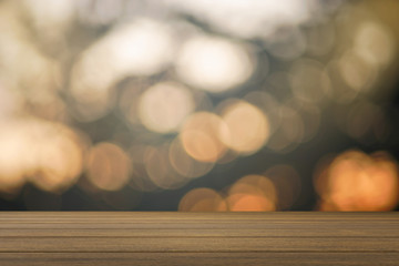 Empty wood table and blurred bokeh out of focus in sunset moment background. product display...