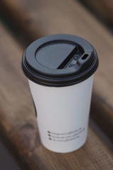 disposable paper cup of coffee