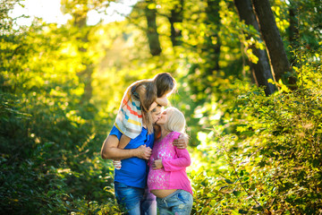 Fototapeta premium family walks in the park