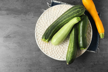 Assorted fresh zucchini on white plate