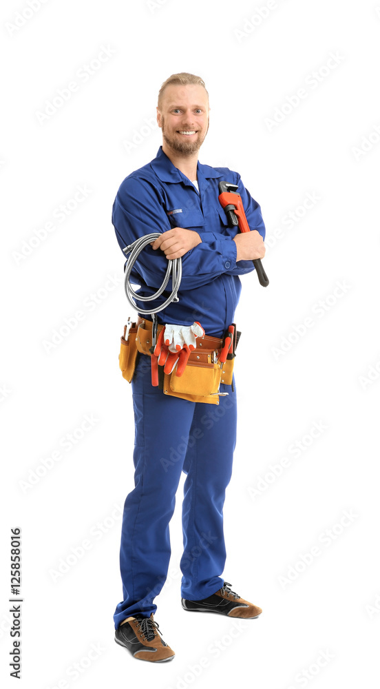 Wall mural handsome plumber with pipe wrench and flexible hose isolated on white