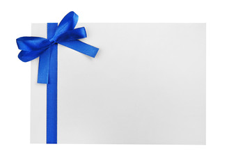 Blue satin ribbon and card on light background