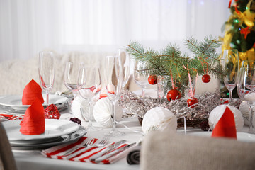 Table served for Christmas dinner in living room, close up view