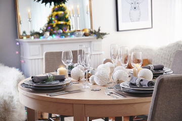 Table served for Christmas dinner in living room