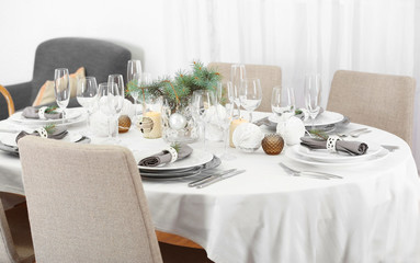 Table served for Christmas dinner in living room