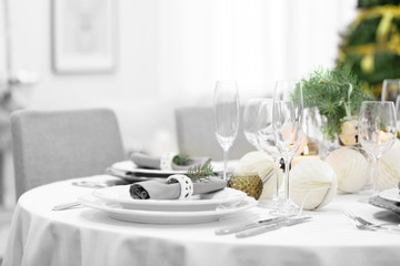 Table served for Christmas dinner in living room, close up view