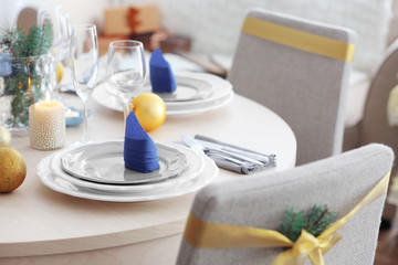 Table served for Christmas dinner in living room, close up view