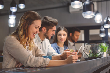 Friends studying together at coffee shop