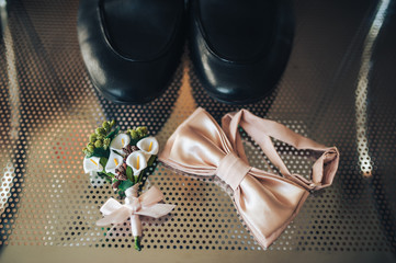 Butterfly tie, boutonniere and shoes