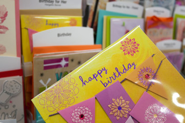 Close up woman holding happy birthday card inside superstore