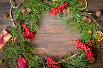 New Year Decoration with Wreath of Pine Branches and Rowan