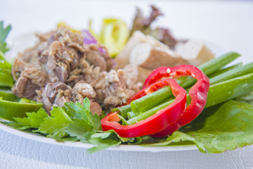 Cooked lamb giblets with vegetables.