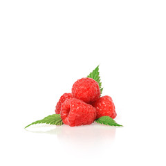 Fresh raspberry with green raspberry leaves isolated on white ba