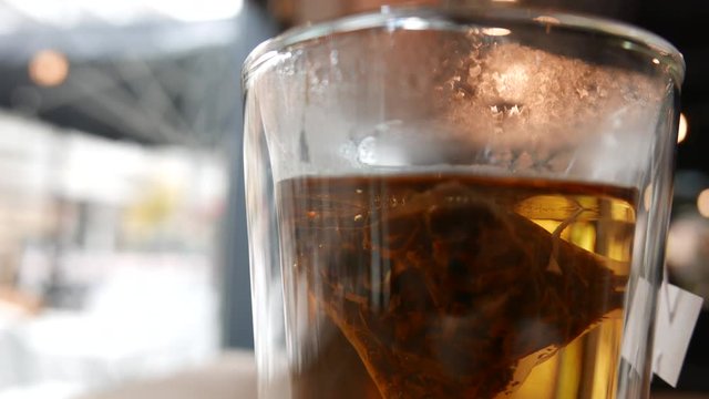 hot tea close up, teabag and steam