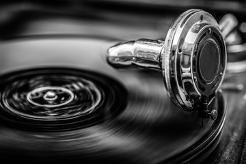 Obraz premium Grammophone playing old disk, in black and white