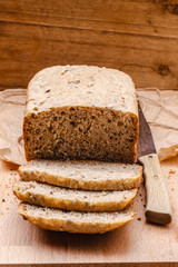 Sliced whole wheat bread on cutting board