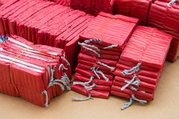 Red firecrackers on brown background