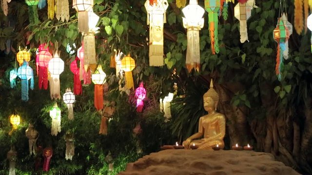 Buddha statue with colourful lanterns in Phan Tao Temple in Chiang Mai